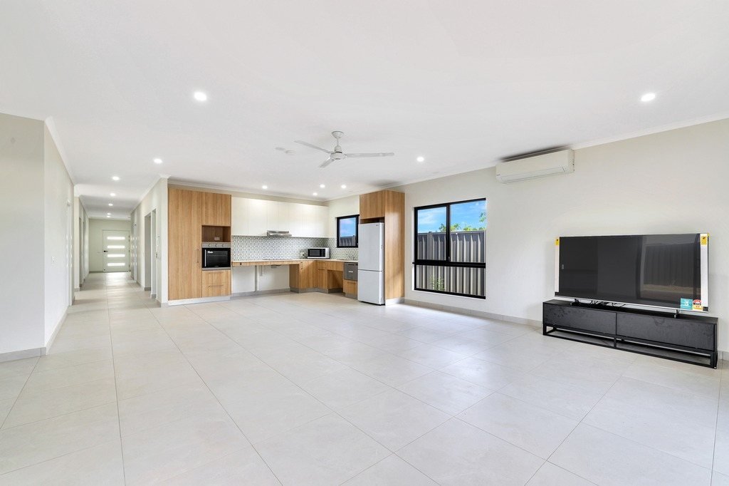 The open-plan living area, with the kitchen beyond.