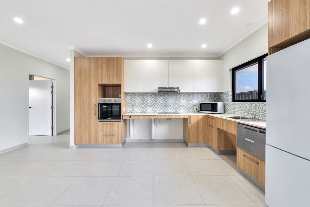 The accessible kitchen, with a height-adjustable bench and wall oven.