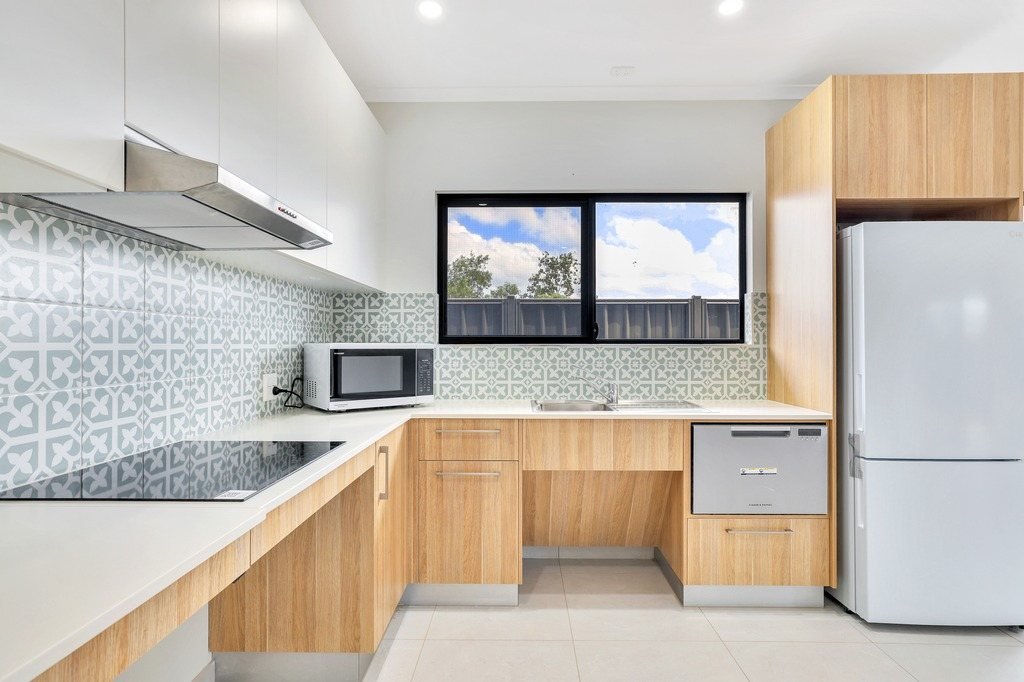 The kitchen bench and cooktop.