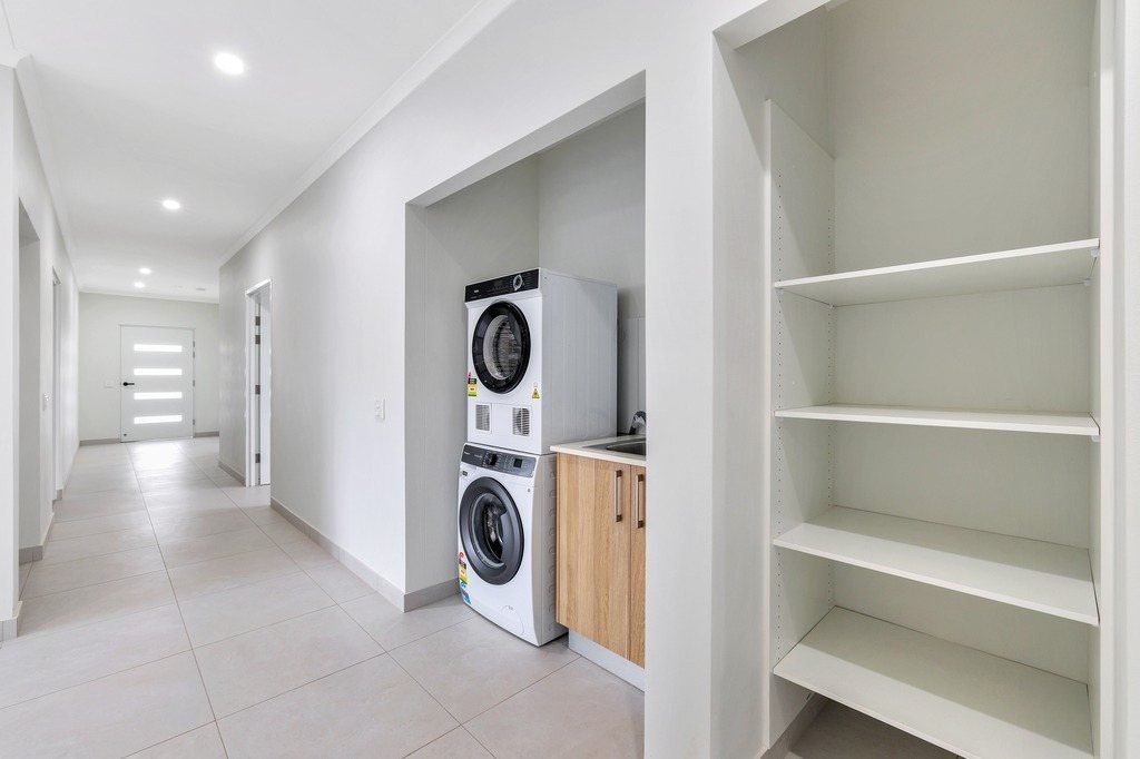 The hallway, with the laundry and storage.