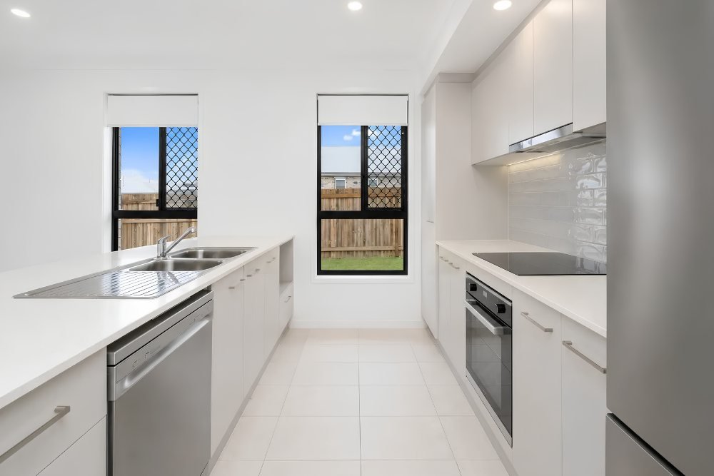 The kitchen, with an oven, cooktop and dishwasher.