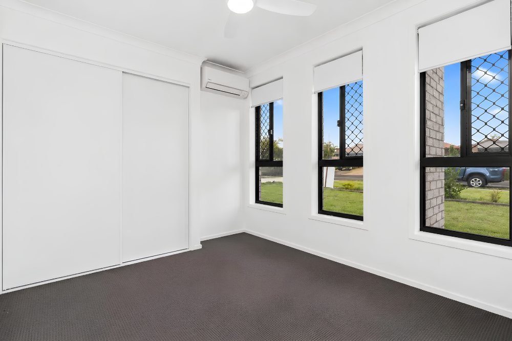 A bedroom with built-in robes.