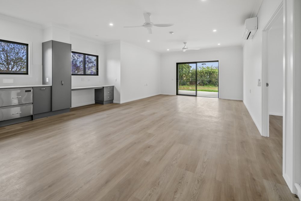The open-plan family and dining area, with the kitchen beyond.