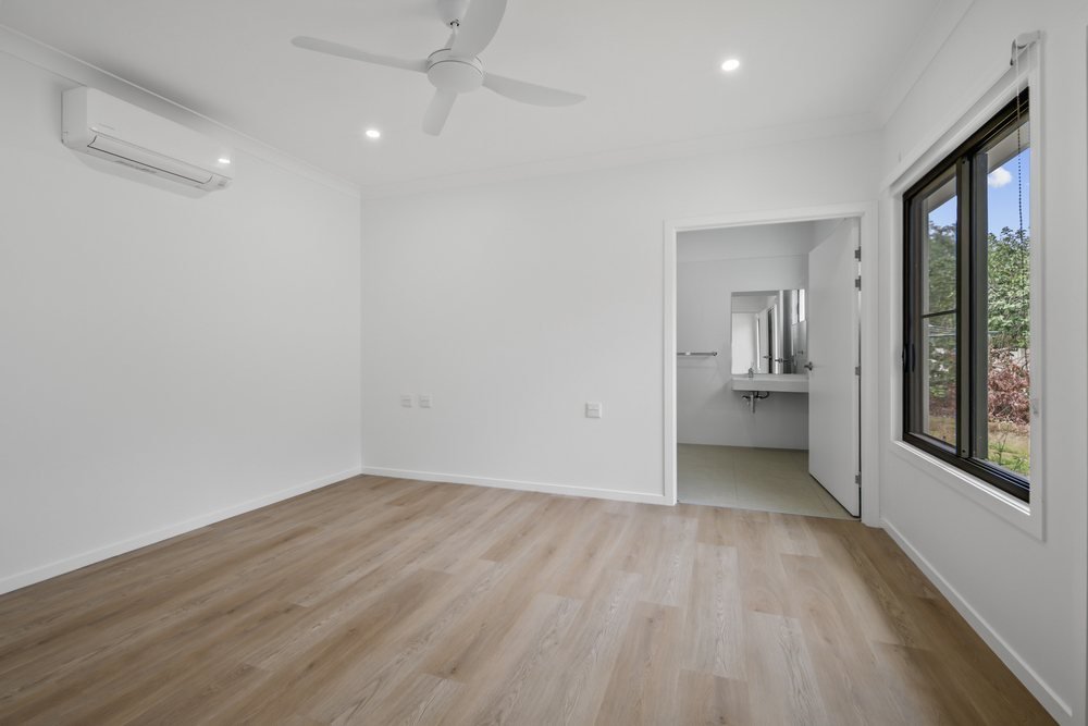 A bedroom looking through to its adjoining retreat.