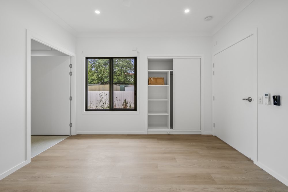 Another retreat, with a ceiling fan, opening to the hallway.
