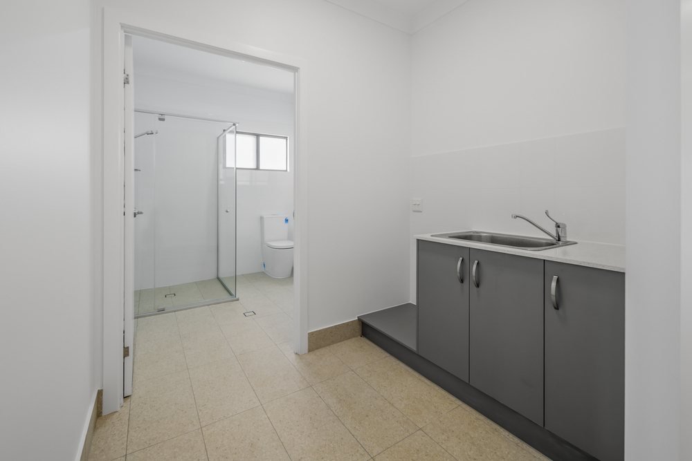 A second accessible ensuite, with a step-free shower and a curtain track.