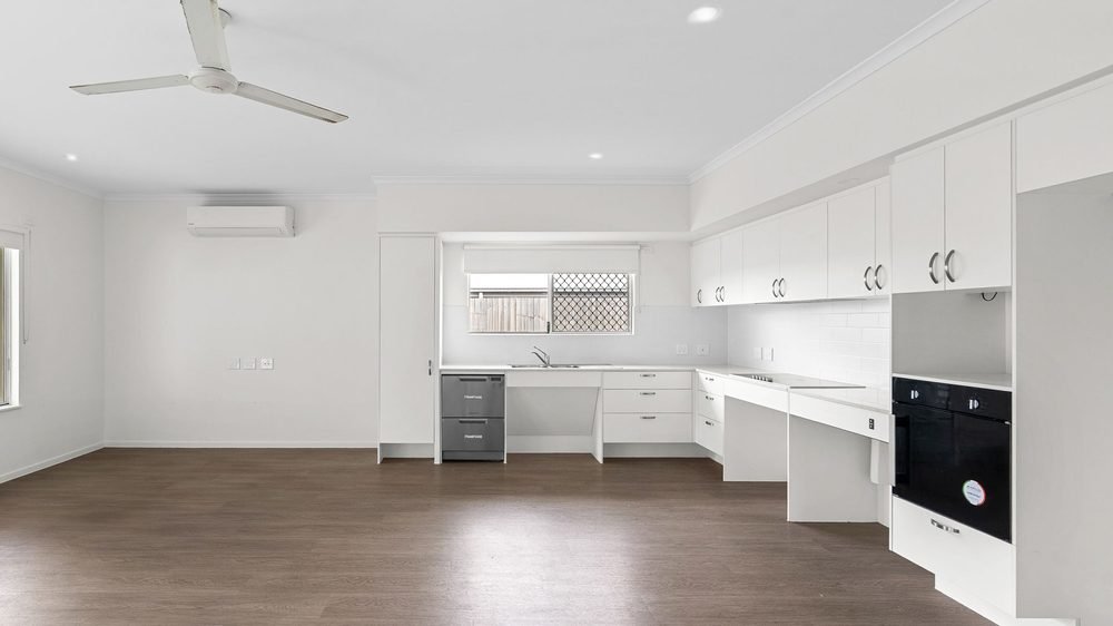 The kitchen, with lowered benches and a wall oven.